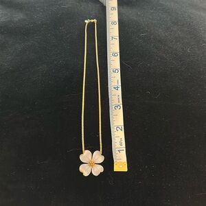 Vintage Monet floral pendant necklace with a delicate gold-tone chain.